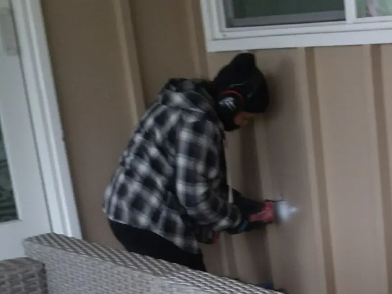 Professional electrician installing an exterior outlet in Snoqualmie